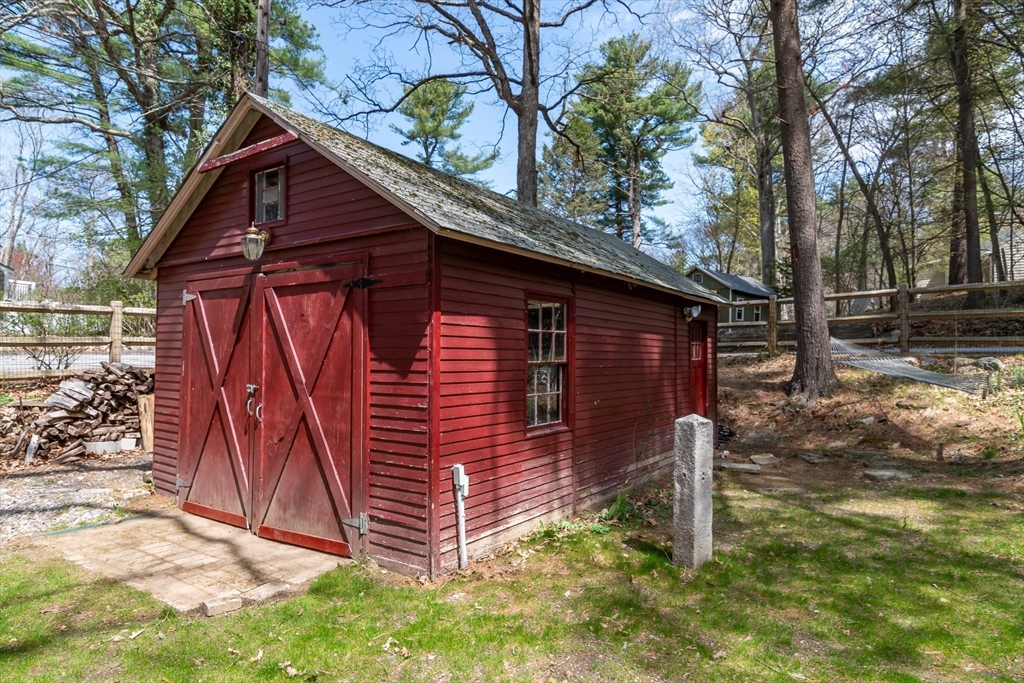 8 Meeting House Hill Road Dover, MA 02030 - Photo 22 of 22 a front view of a house with a yard