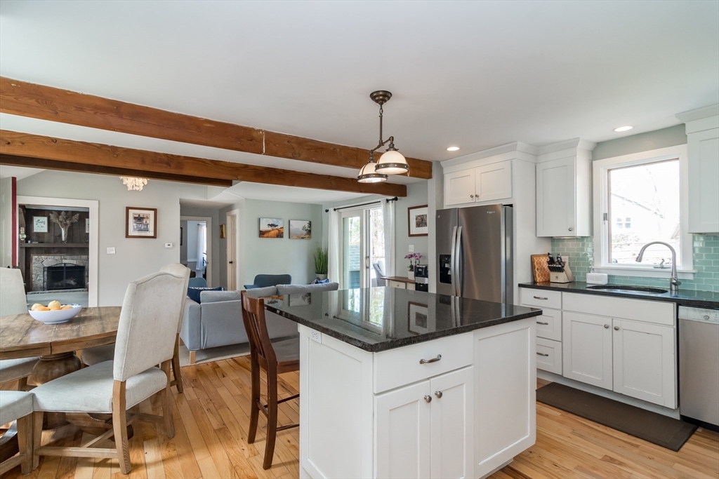 8 Meeting House Hill Road Dover, MA 02030 - Photo 6 of 22 a kitchen with stainless steel appliances granite countertop a sink refrigerator and cabinets