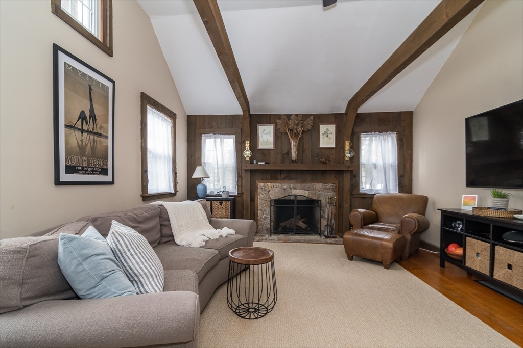 8 Meeting House Hill Road Dover, MA 02030 - Photo 8 of 22 a living room with furniture and a flat screen tv