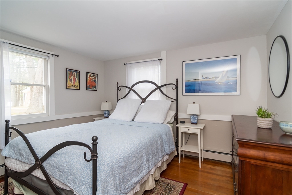 8 Meeting House Hill Road Dover, MA 02030 - Photo 10 of 22 a bedroom with a bed and a dresser with mirror