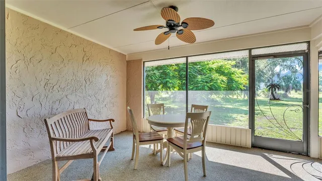 a view of a room with furniture and a window