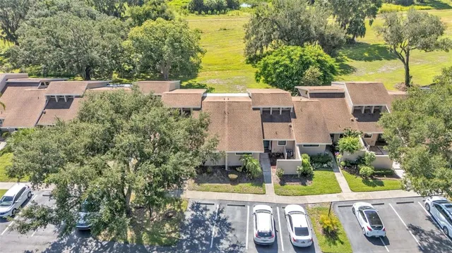 an aerial view of a house with a garden