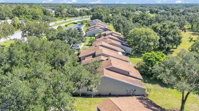 an aerial view of house with yard