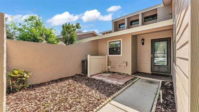 a view of a house with a backyard