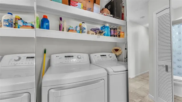 a utility room with dryer and washer