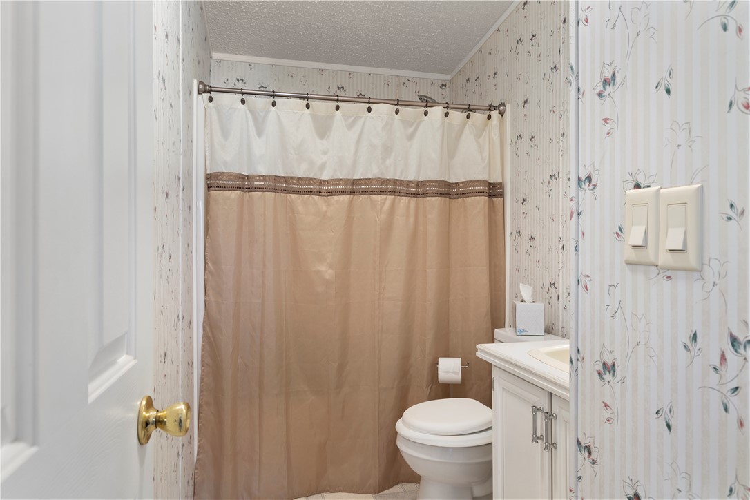 811 Pine Grove Road Seneca, SC 29678 - Photo 13 of 20 This cozy bathroom offers a functional design with traditional accents for daily comfort.