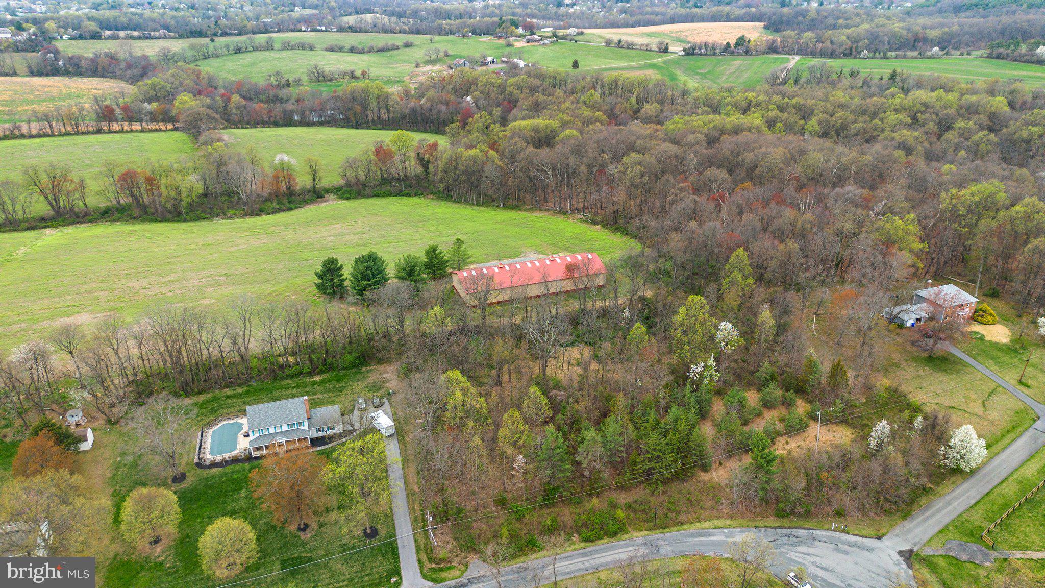 26132 Viewland Drive Damascus, MD 20872 - Photo 11 of 15 a view of a lake with a yard