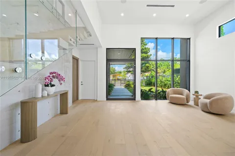 a kitchen that has a table and chairs in it