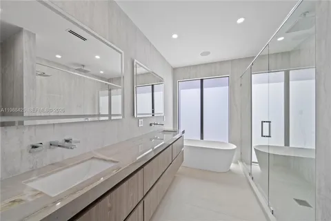 a close view of a sink and cabinets