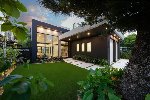 a dining room with a table and chairs