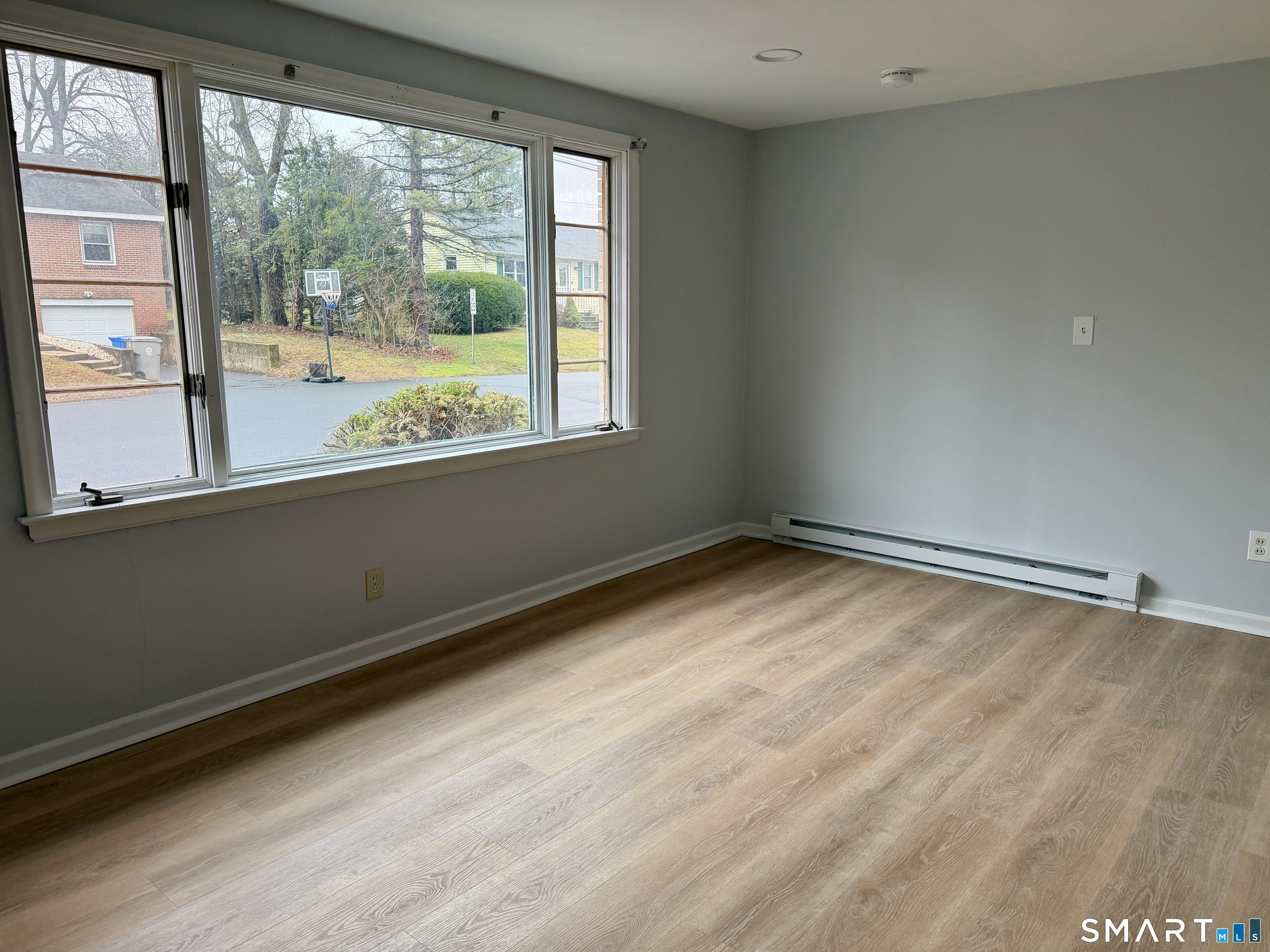 164 Sycamore Street, Unit 1R Bristol, CT 06010 - Photo 6 of 10 a view of a room with a large window