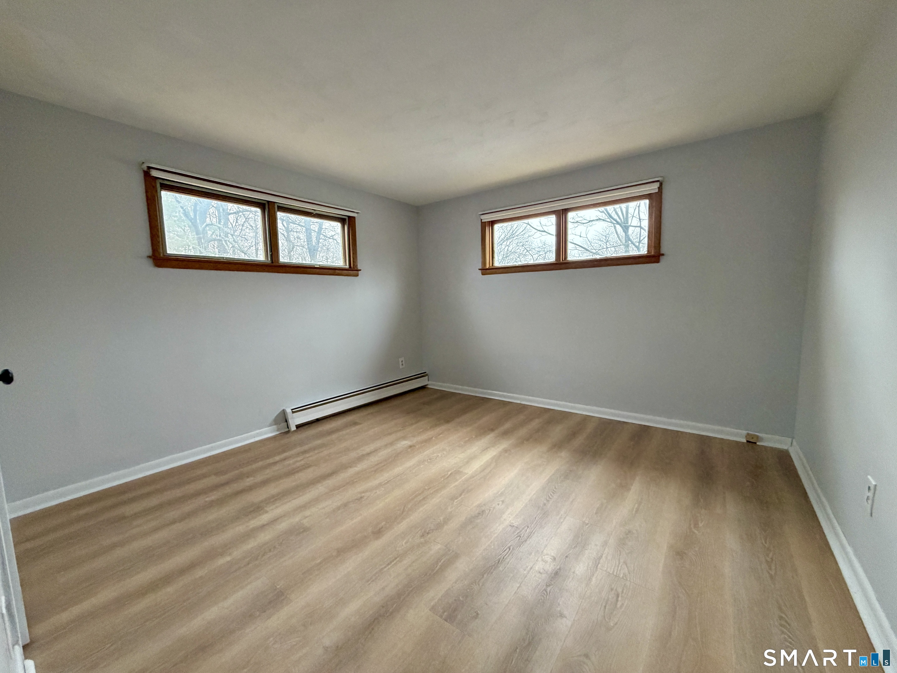 164 Sycamore Street, Unit 1R Bristol, CT 06010 - Photo 9 of 10 a view of a room with wooden floor and window