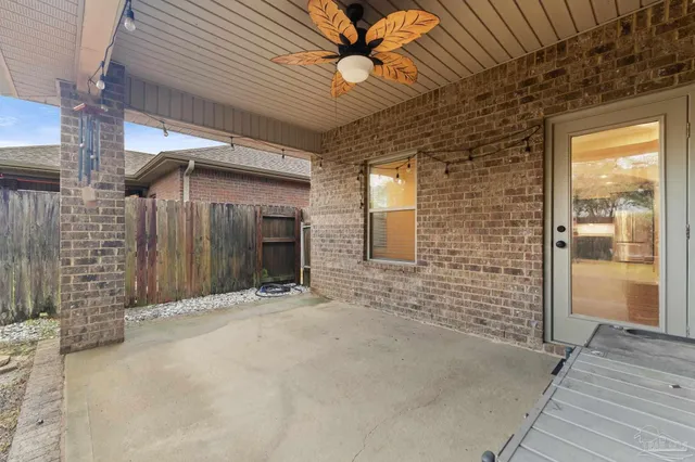 a view of a brick house with a large window