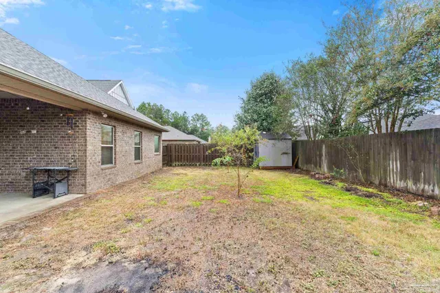 a swimming pool with trees in the background