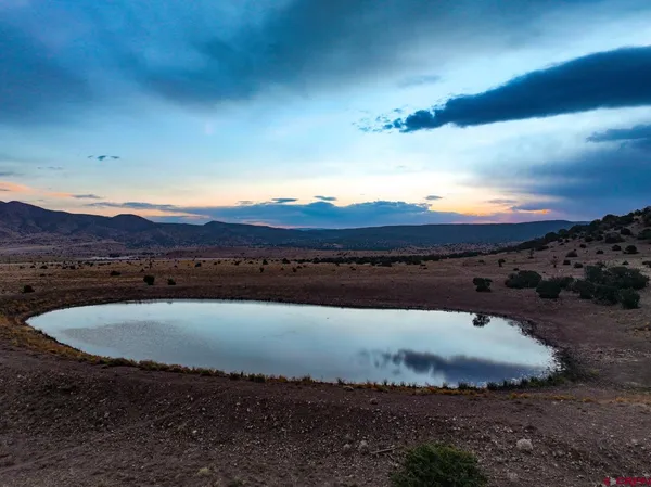 a view of a house with a mountain in the background