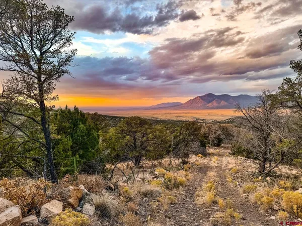 a view of an ocean and a mountain