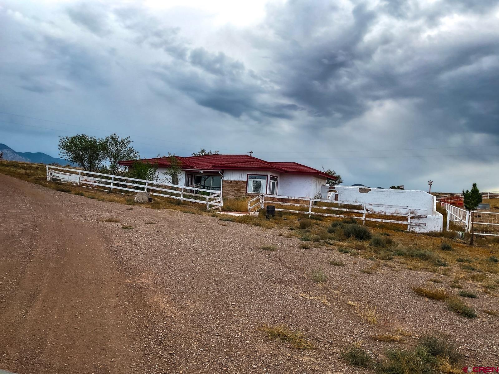 0 Us 380 Carrizozo, NM 88301 - Photo 26 of 34 a view of a lake with a house in the background