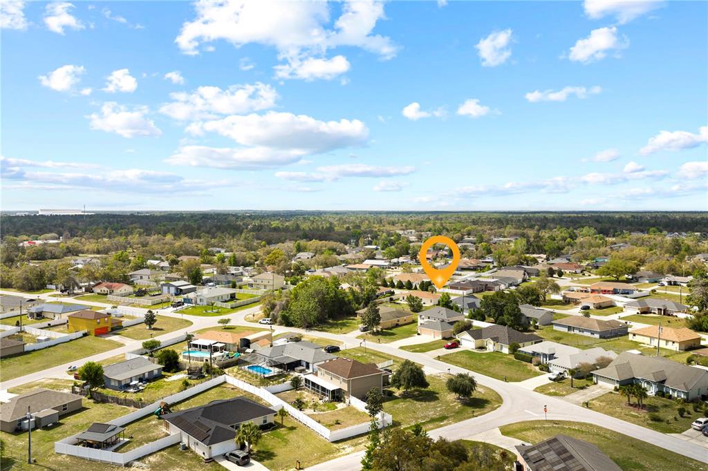 2881 Southwest 142nd Lane Ocala, FL 34473 - Photo 21 of 60 an aerial view of residential building with parking space