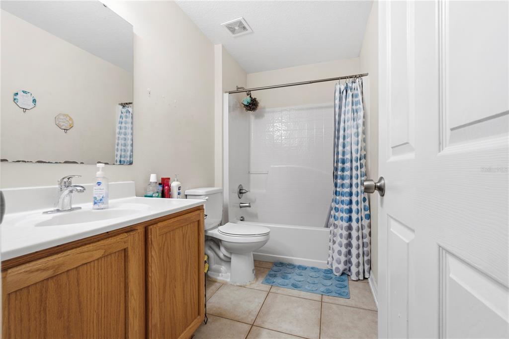 2881 Southwest 142nd Lane Ocala, FL 34473 - Photo 24 of 60 a bathroom with a granite countertop sink toilet and shower