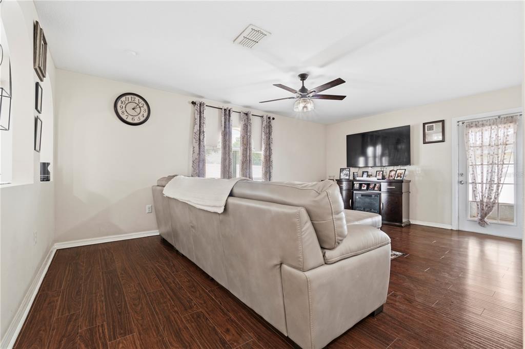 2881 Southwest 142nd Lane Ocala, FL 34473 - Photo 32 of 60 a living room with furniture and a wooden floor