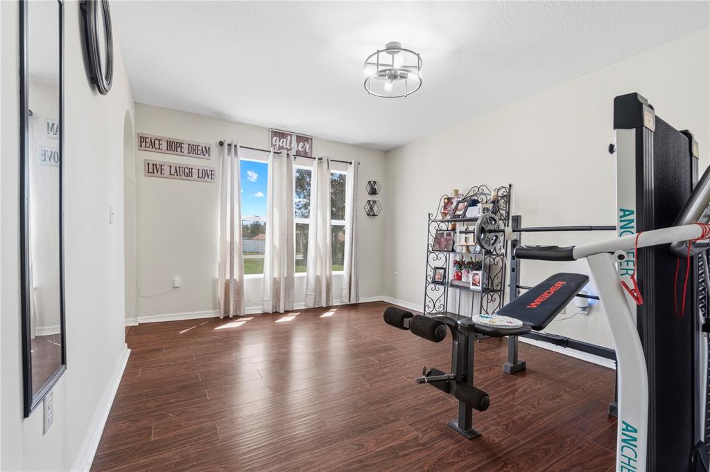 2881 Southwest 142nd Lane Ocala, FL 34473 - Photo 40 of 60 a view of a room with gym equipment