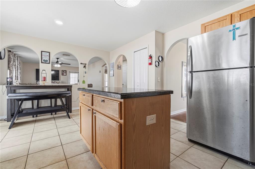 2881 Southwest 142nd Lane Ocala, FL 34473 - Photo 42 of 60 a kitchen with stainless steel appliances granite countertop a refrigerator and a stove