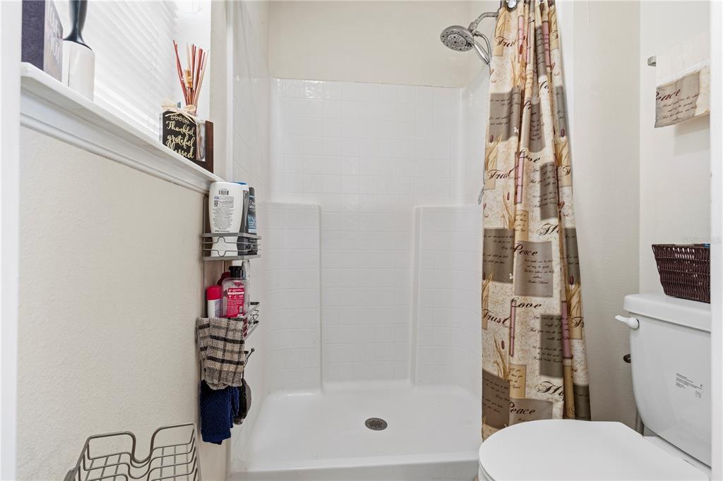 2881 Southwest 142nd Lane Ocala, FL 34473 - Photo 5 of 60 a bathroom with a toilet and shower