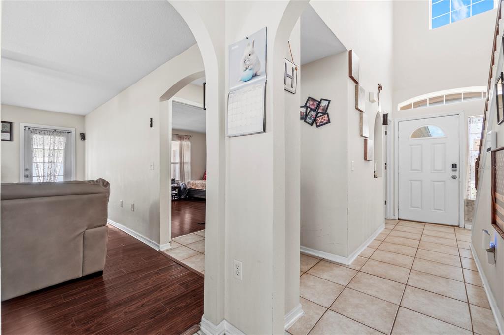 2881 Southwest 142nd Lane Ocala, FL 34473 - Photo 54 of 60 a view of an entryway with wooden floor and a livingroom