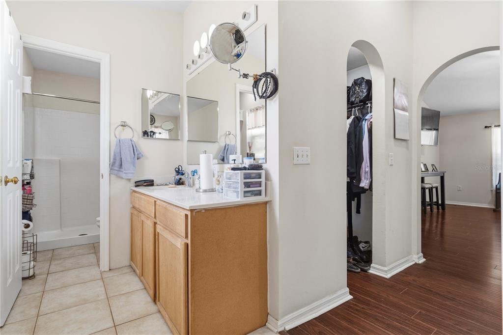 2881 Southwest 142nd Lane Ocala, FL 34473 - Photo 7 of 60 a bathroom with a sink vanity and a mirror