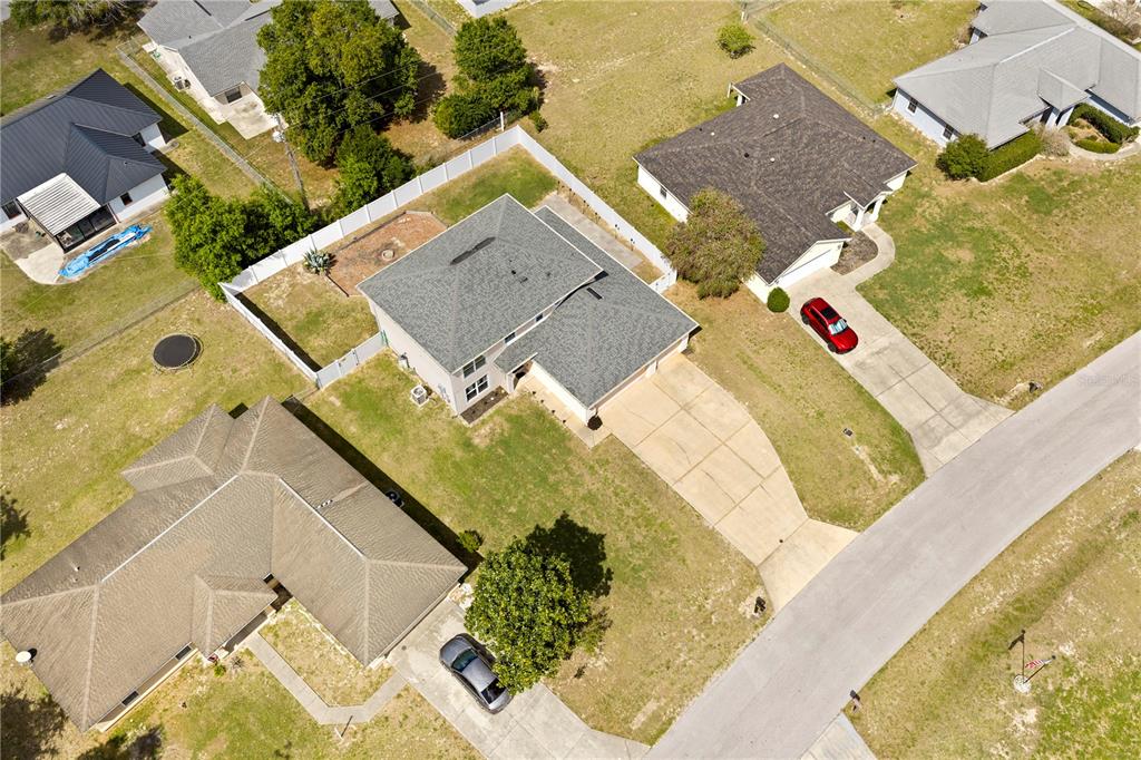 2881 Southwest 142nd Lane Ocala, FL 34473 - Photo 9 of 60 an aerial view of a house with a swimming pool