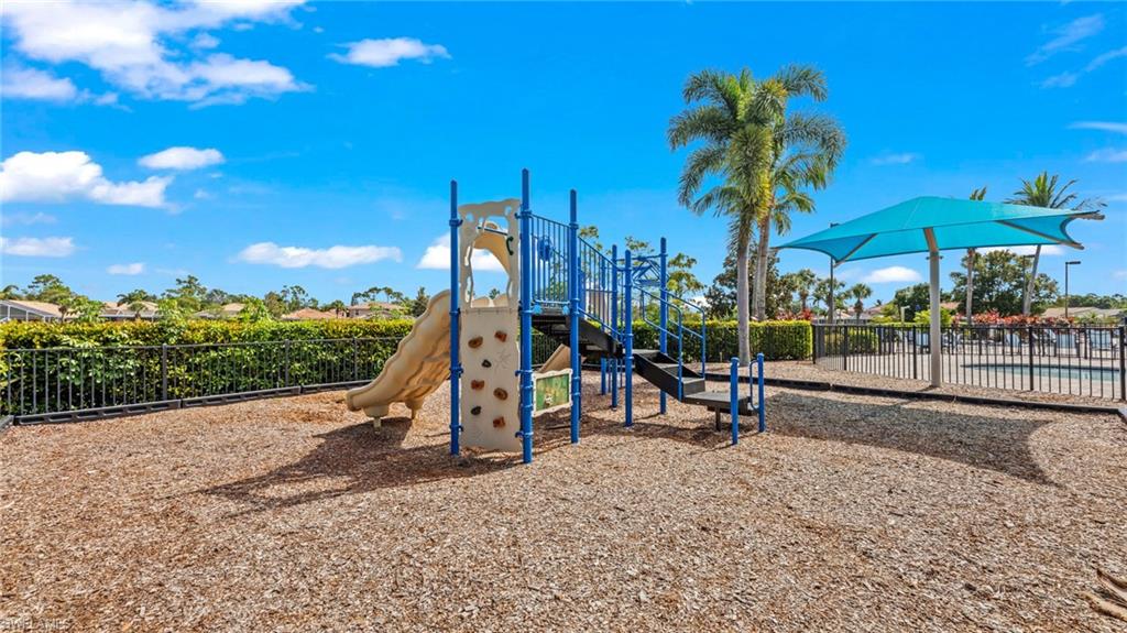 19740 Villa Rosa Loop Estero, FL 33967 - Photo 41 of 42 a view of a park with swings and slides