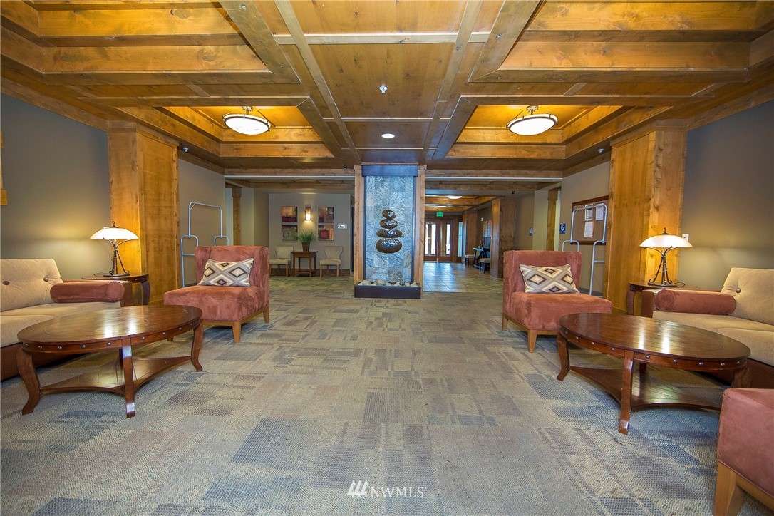3770 Suncadia Trail, Unit 110 Cle Elum, WA 98922 - Photo 2 of 21 a living room with furniture and a chandelier