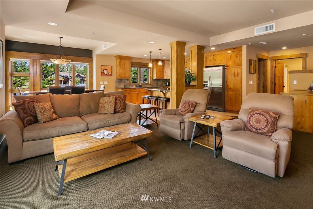 3770 Suncadia Trail, Unit 110 Cle Elum, WA 98922 - Photo 4 of 21 a living room with furniture and a large window