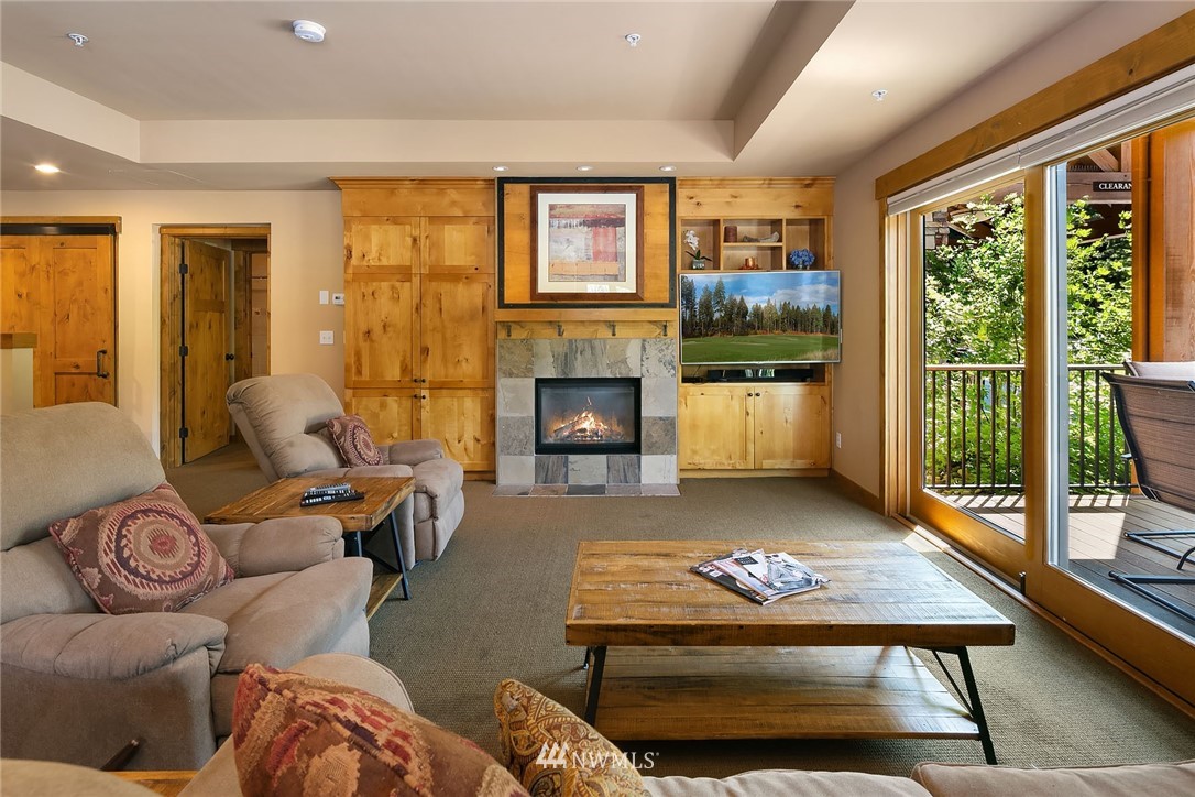 3770 Suncadia Trail, Unit 110 Cle Elum, WA 98922 - Photo 5 of 21 a living room with furniture large window and fireplace