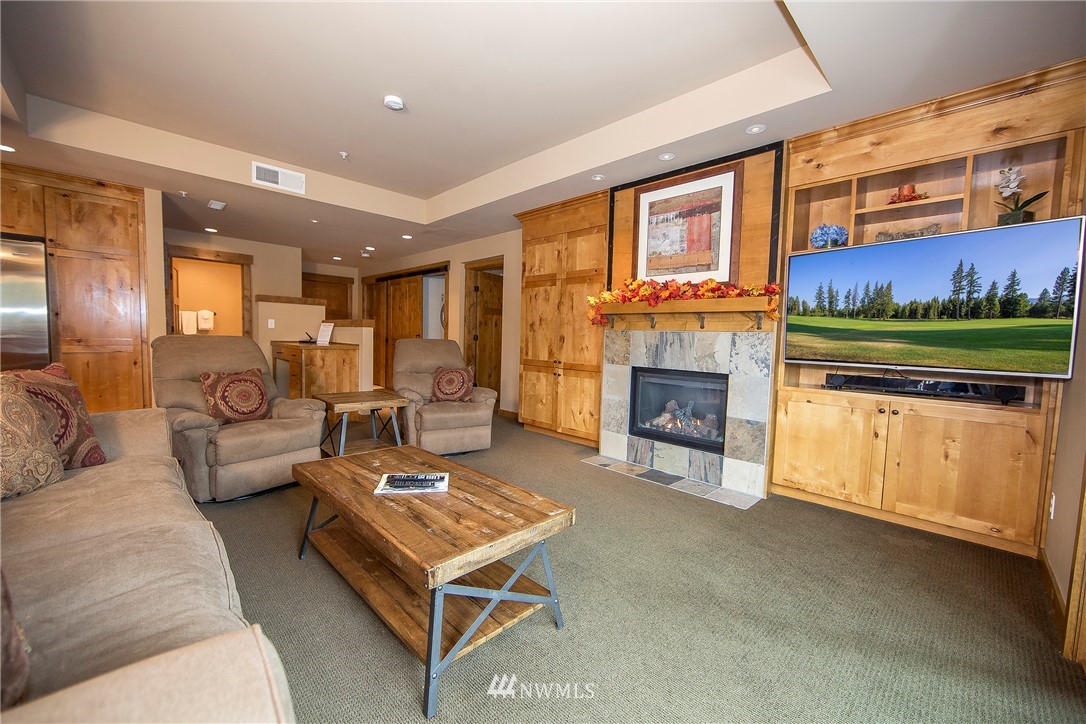 3770 Suncadia Trail, Unit 110 Cle Elum, WA 98922 - Photo 7 of 21 a living room with furniture and a fireplace