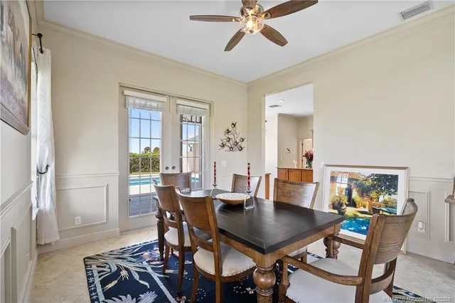 a view of a house with a big yard and large trees