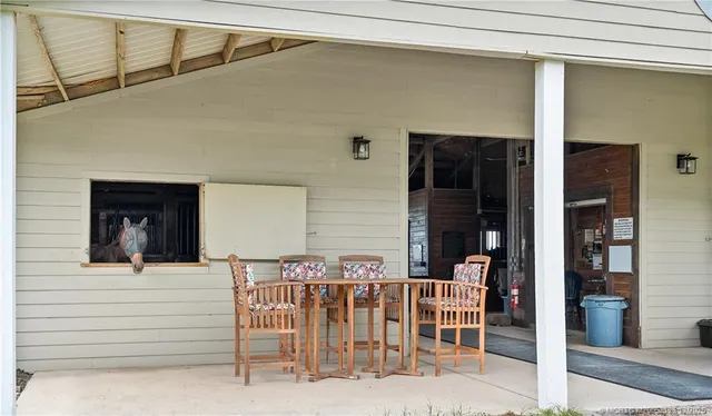 a view of a chairs and table on the terrace