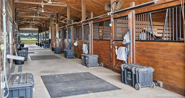 a view of a street with a floor to ceiling window stairs and an outdoor view