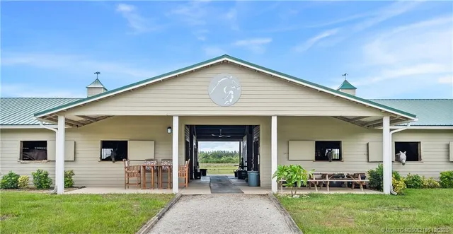 a view of swimming pool with furniture