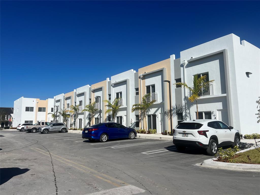 a view of a cars parked in front of a building