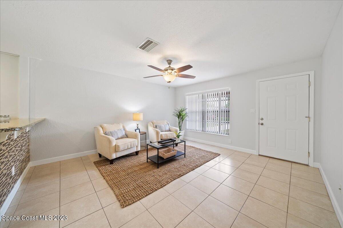 1040 Bernice Road Rockledge, FL 32955 - Photo 4 of 24 a living room with furniture