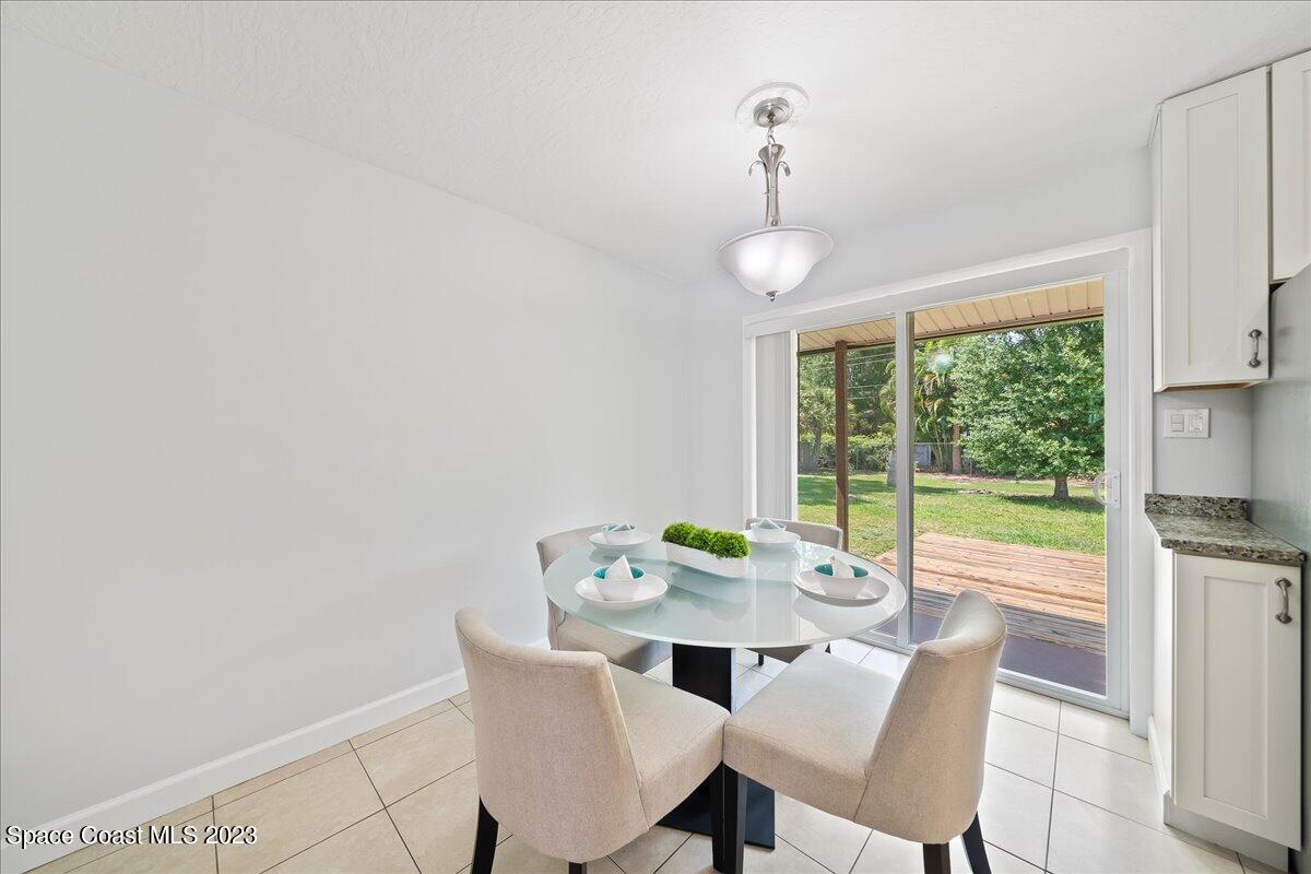 1040 Bernice Road Rockledge, FL 32955 - Photo 8 of 24 a view of a dining room with furniture window and outside view