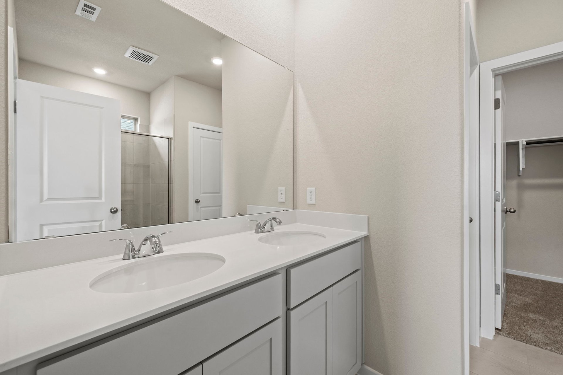 144 Wind Hill Jarrell, TX 76537 - Photo 19 of 26 Primary Bath retreat with dual vanities & walk-in shower