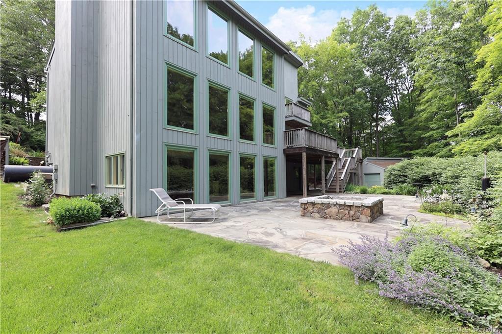 87 Saunders Lane Ridgefield, CT 06877 - Photo 1 of 1 a view of a house with backyard and sitting area