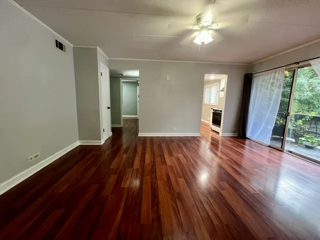 a bathroom with a toilet and a mirror