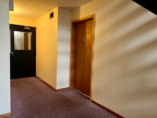 a view of cars parked on the side of a street
