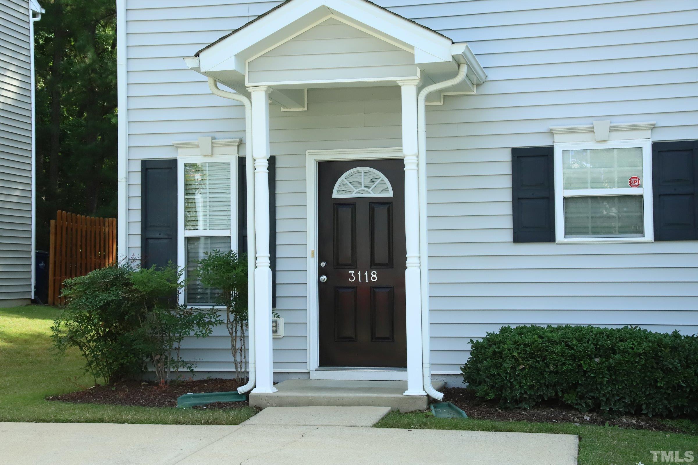 3118 Binghampton Lane Raleigh, NC 27604 - Photo 2 of 27 a front view of a house with a garden