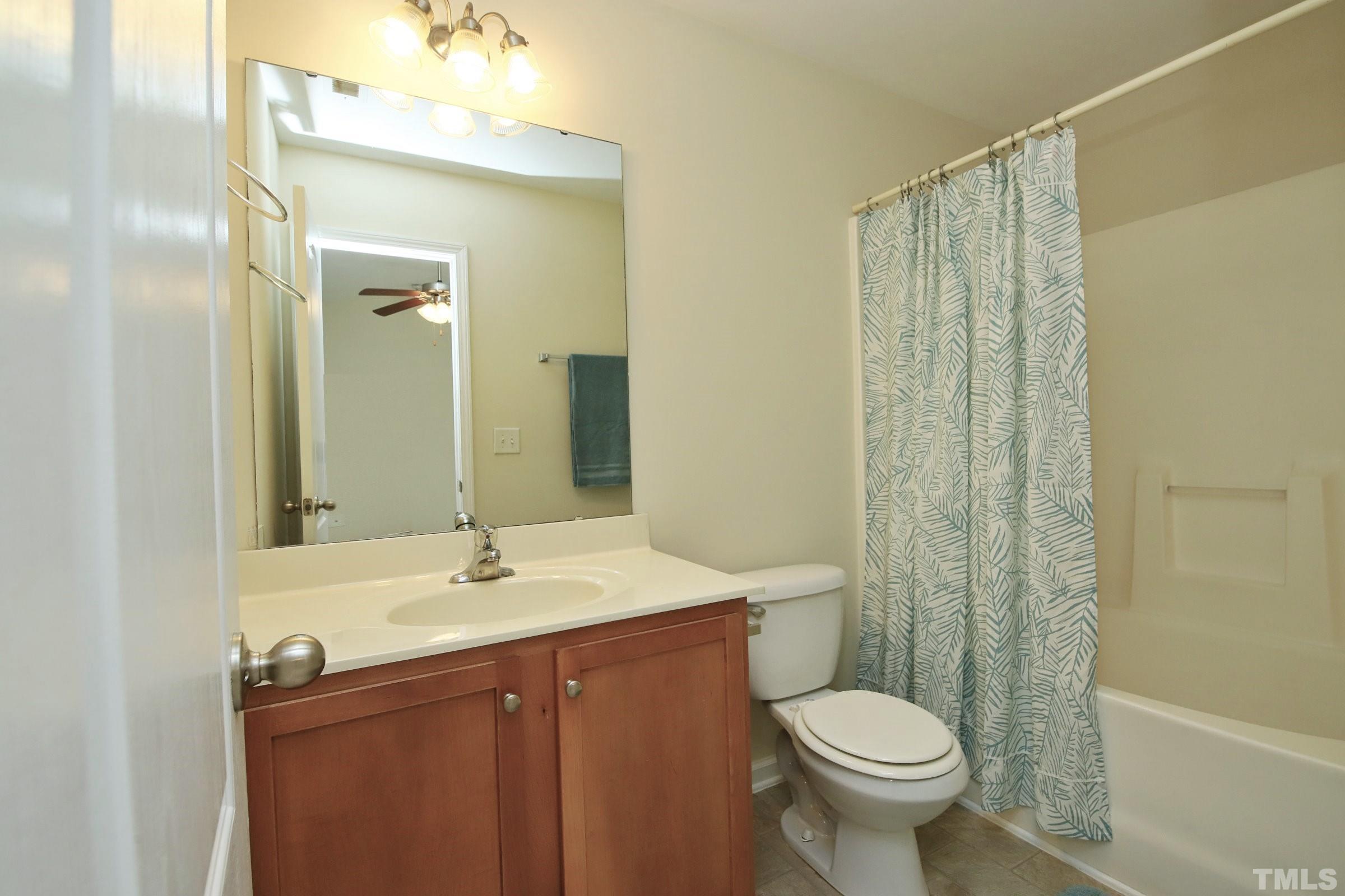 3118 Binghampton Lane Raleigh, NC 27604 - Photo 16 of 27 a bathroom with a sink toilet and shower