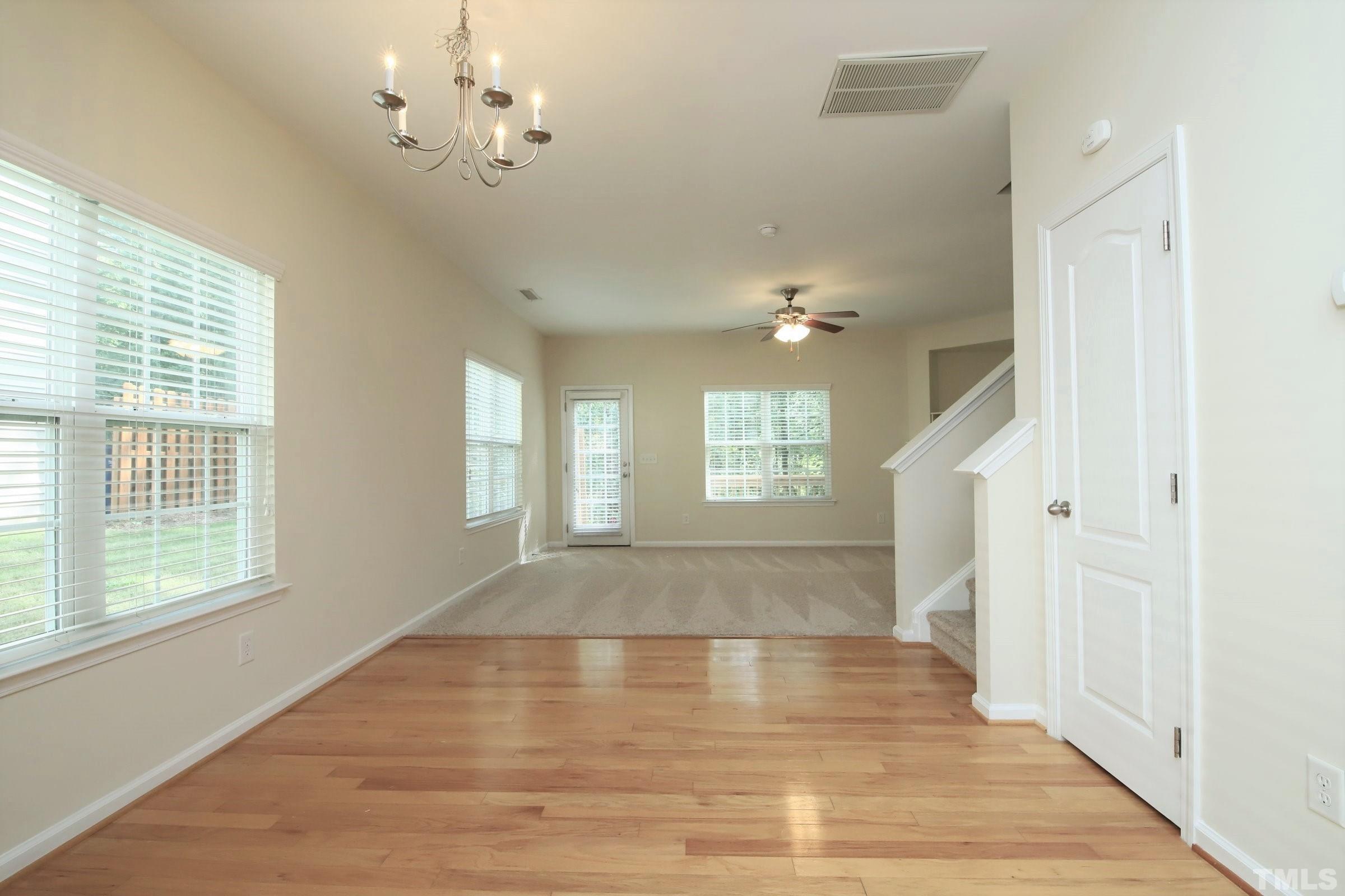 3118 Binghampton Lane Raleigh, NC 27604 - Photo 3 of 27 a view of an empty room with wooden floor and a window