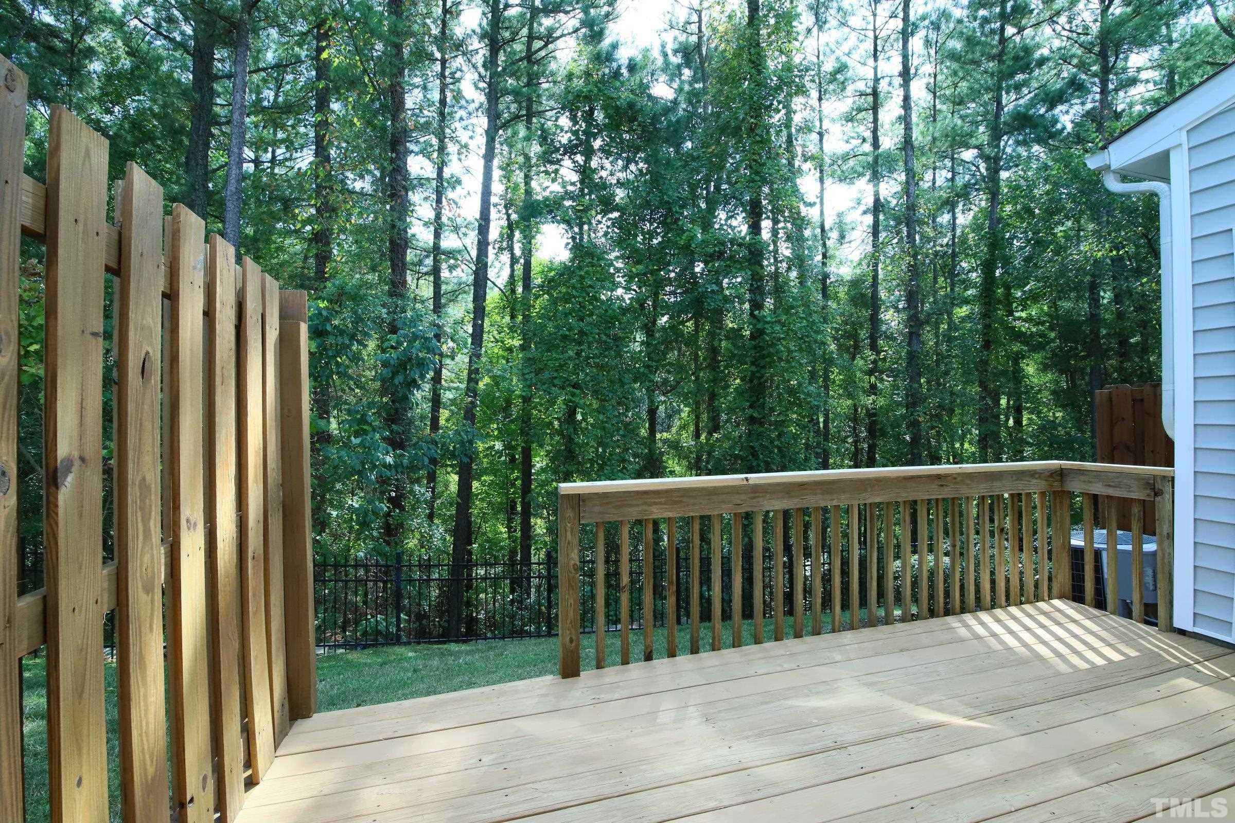 3118 Binghampton Lane Raleigh, NC 27604 - Photo 23 of 27 a balcony with trees in front of it